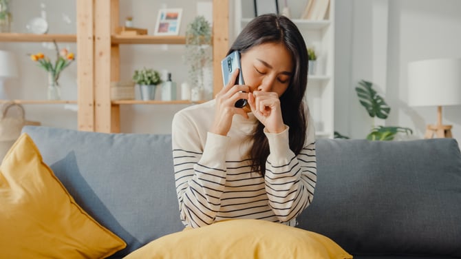 sick-young-asian-woman-hold-medicine-use-smartphon-2021-09-02-09-22-47-utc